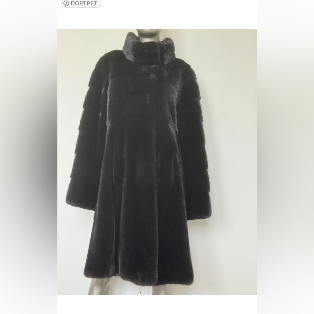 Luxurious black fur coat made of natural mink fur.